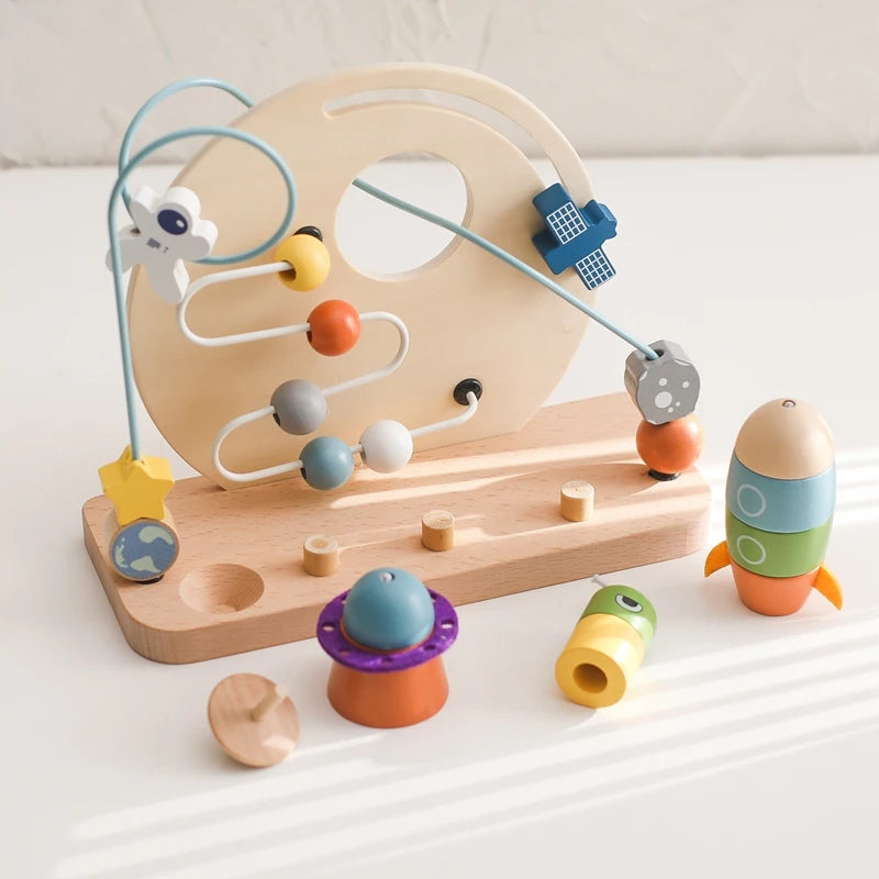 Introduce your Little One to the wonders of learning with our Montessori Wooden Beaded Planet Toy! This beautifully crafted wooden toy is designed to stimulate early learning, enhance hand-eye coordination, and improve finger grip.