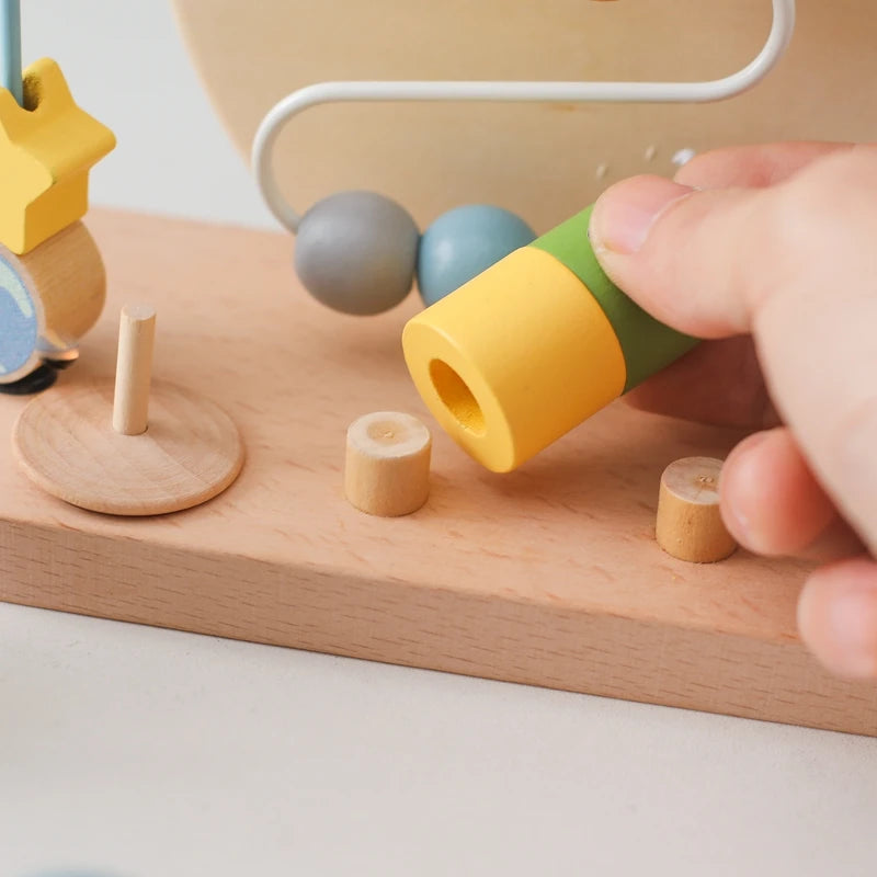 Introduce your Little One to the wonders of learning with our Montessori Wooden Beaded Planet Toy! This beautifully crafted wooden toy is designed to stimulate early learning, enhance hand-eye coordination, and improve finger grip.