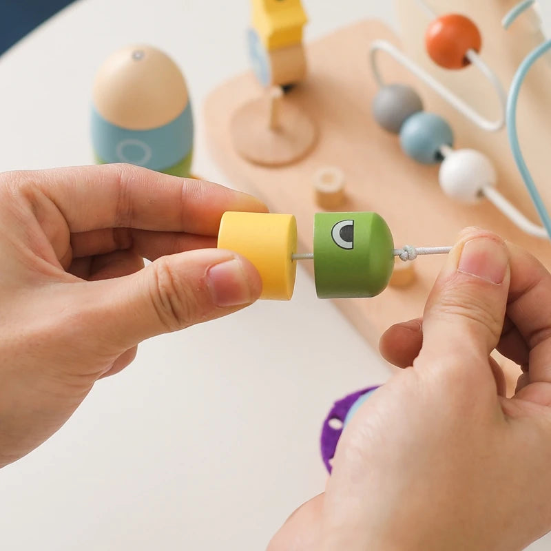 Introduce your Little One to the wonders of learning with our Montessori Wooden Beaded Planet Toy! This beautifully crafted wooden toy is designed to stimulate early learning, enhance hand-eye coordination, and improve finger grip.