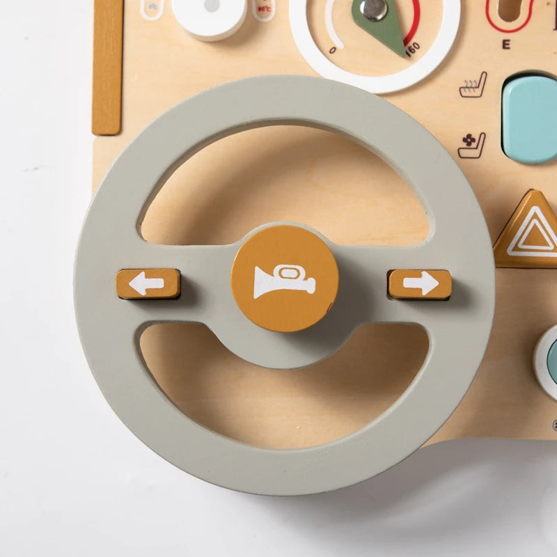 Ignite your child’s curiosity with our Montessori Wooden Car Steering Wheel Activity Busy Board! This interactive sensory toy is designed to captivate your baby’s attention, encouraging them to explore, touch, and learn. Featuring multiple activities, including a car steering wheel, this wooden toy helps develop fine motor skills, hand-eye coordination, and sensory awareness while making learning fun.