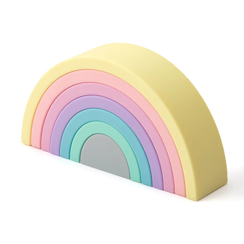 Introduce your little one to a world of color, creativity, and sensory development with our Rainbow Stacking Toy. This versatile montessori toy encourages imaginative play while enhancing motor skills and hand-eye coordination. Made from soft silicone, the stackable rainbow pieces also double as a teether toy, offering soothing relief for your baby’s gums during teething stages.